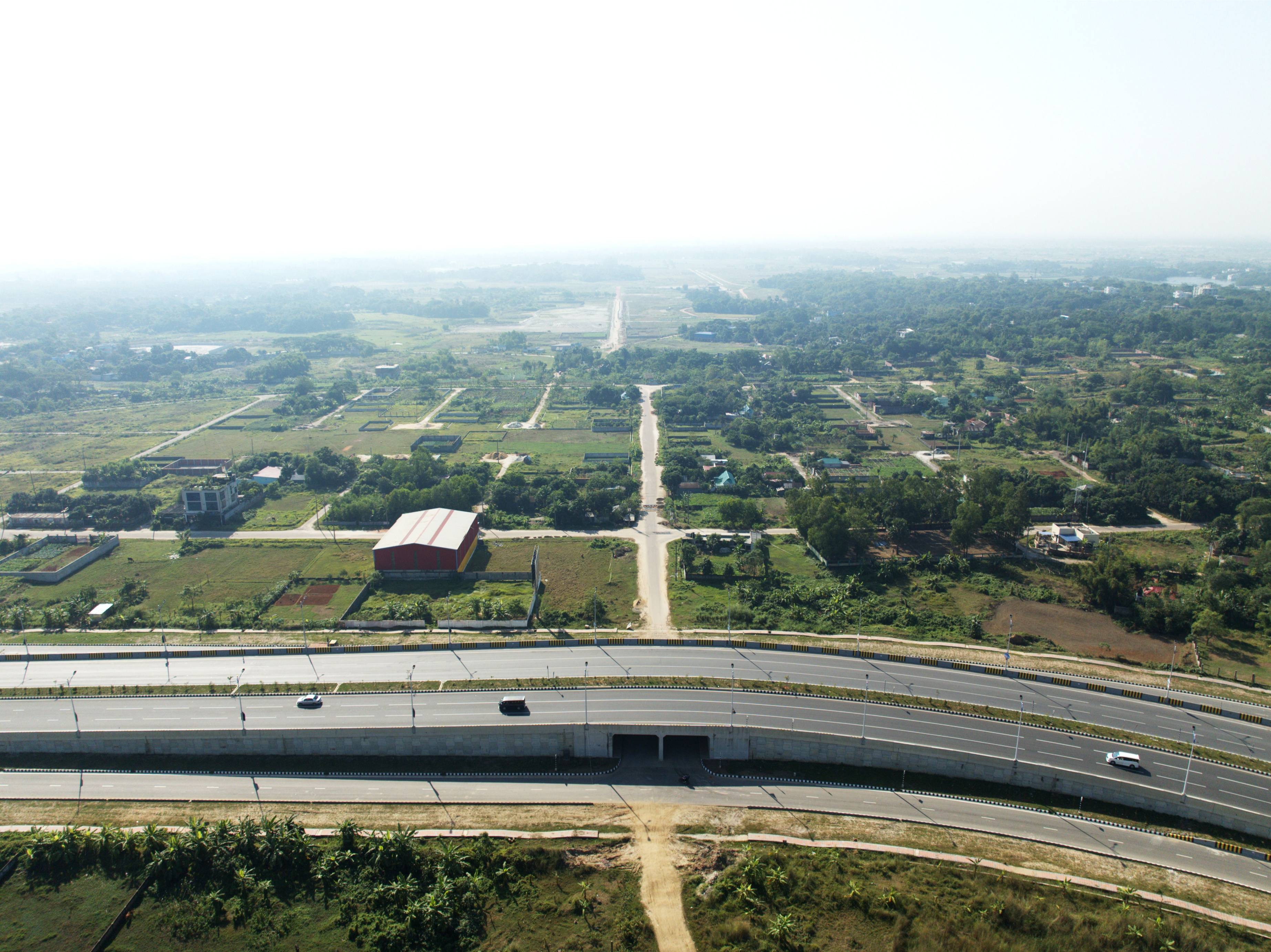 Aerial view of the Anondo Housing Society project and adjacent road